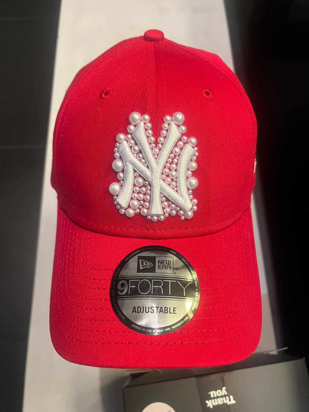 Red pearled New York Yankees cap